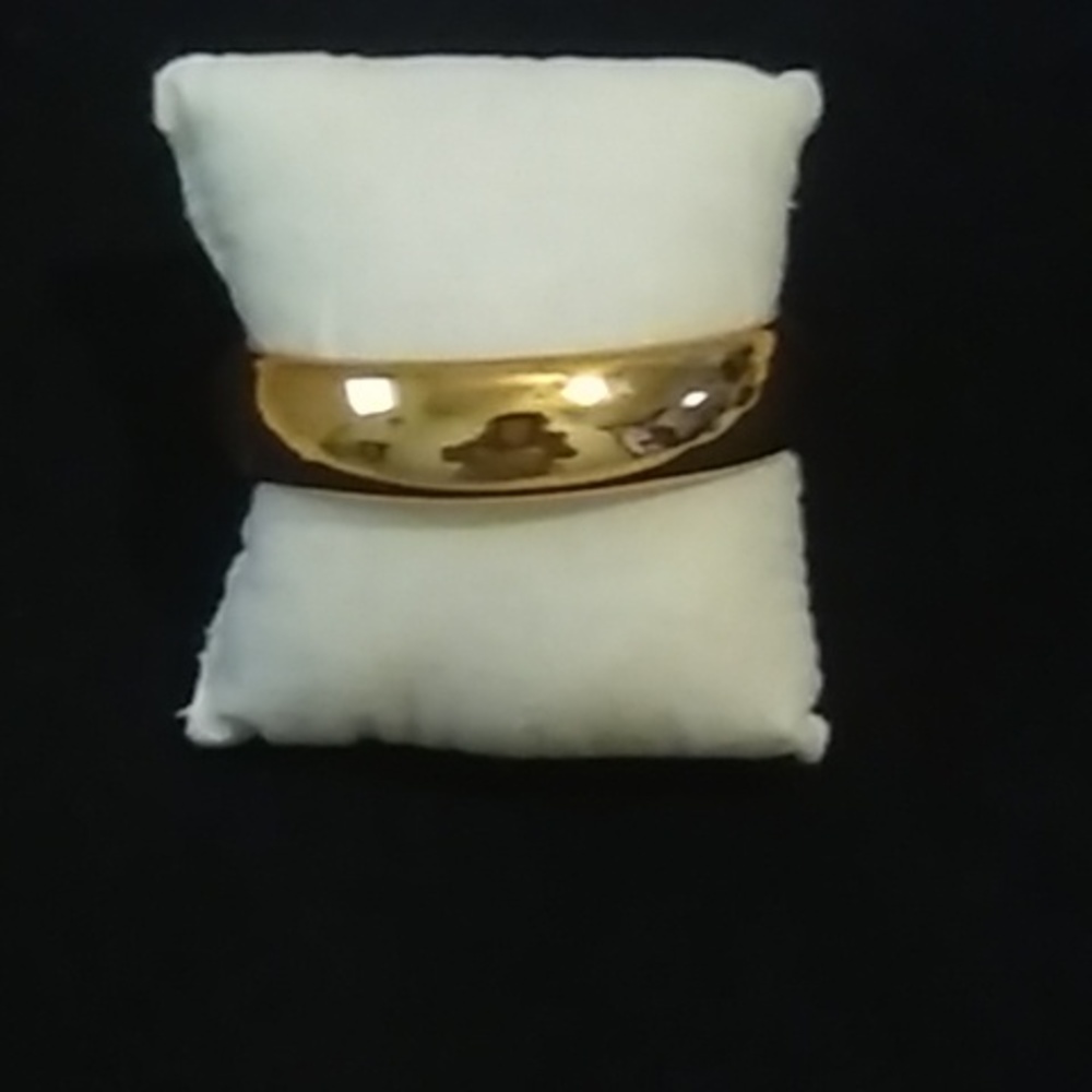 Brand Macy's Gold color bracelet. New never used. One size fits all.